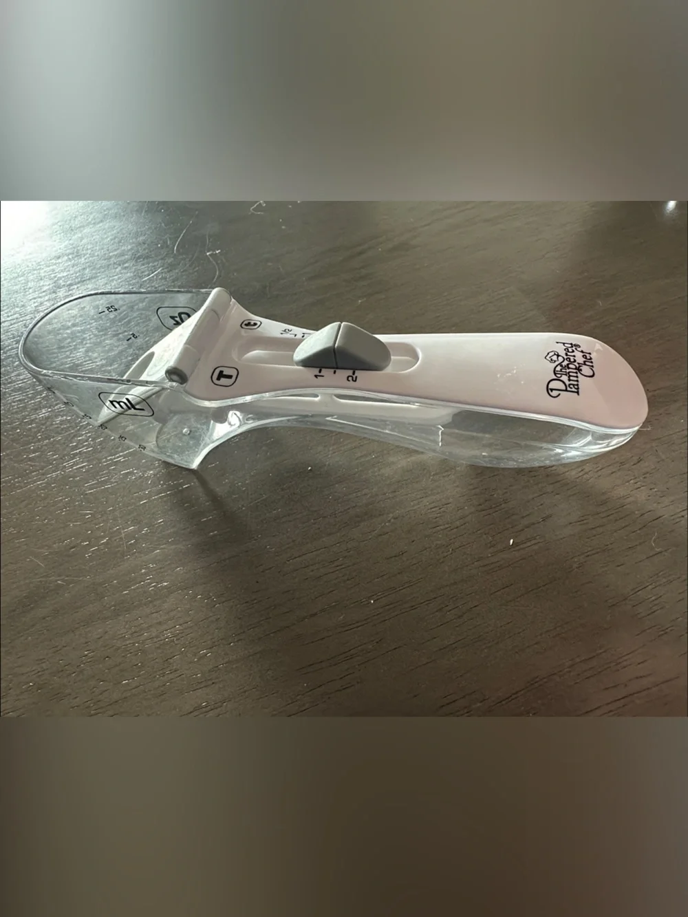 Pampered Chef White Adjustable Measuring Spoon- All-In-One measuring Spoon